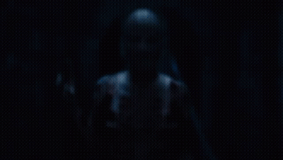 A Person With A Cage Around Their Head Has The Letter S On Their Chest GIF