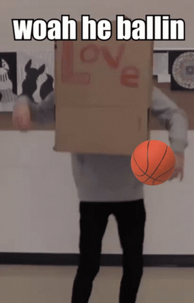 A Person With A Cardboard Box On Their Head Holding A Basketball And The Words Woah He Ballin Above Them GIF