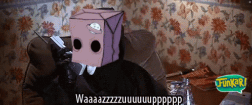 A Person With A Cardboard Box On Their Head Is Sitting On A Couch With A Speech Bubble That Says Jungle GIF