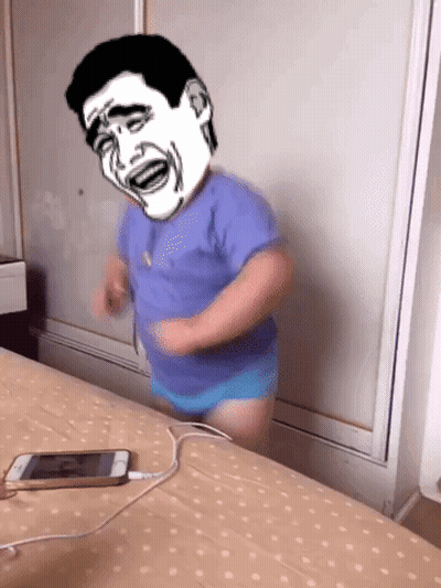 A Person With A Cartoon Face On Their Head Is Standing On A Bed GIF