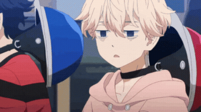 A Person With A Choker Around Their Neck Is Sitting In A Chair GIF