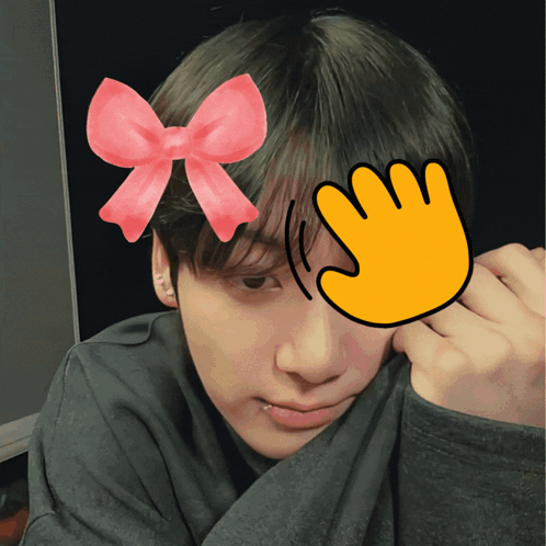 A Person With A Pink Bow On Their Head And A Yellow Hand Covering Their Face GIF