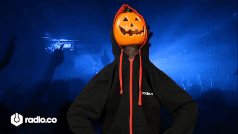 A Person With A Pumpkin On Their Head Is Wearing A Radio.co Sweatshirt GIF
