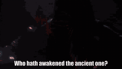 A Person With A Red Light Behind Them And The Words " Who Hath Awakened The Ancient One " GIF