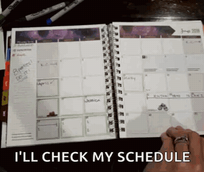 A Person With A Ring On Their Finger Is Checking Their Schedule GIF