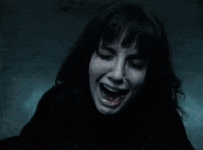A Person With A Ring On Their Finger Is Holding A Black Object GIF