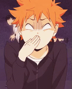 A Person With Orange Hair Is Covering Their Mouth With Their Hand . GIF