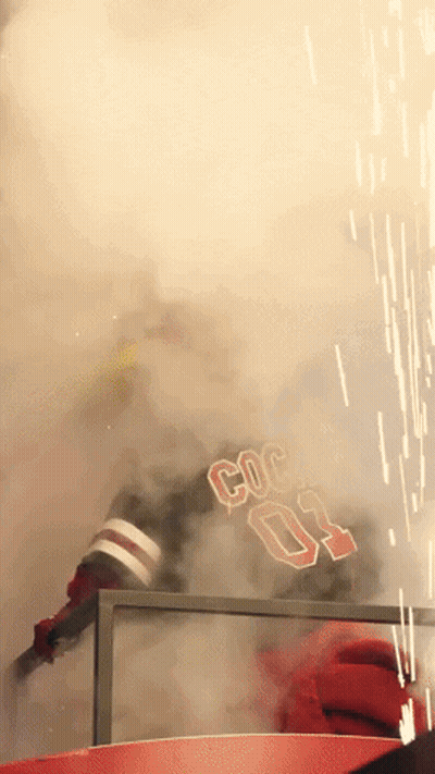 A Person With The Number 03 On Their Jersey Is Surrounded By Smoke GIF