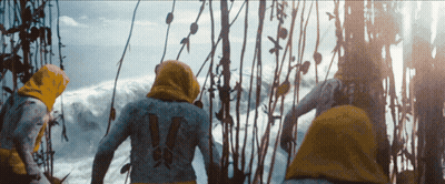 A Person With The Number 14 On Their Back Stands In Front Of A Body Of Water GIF