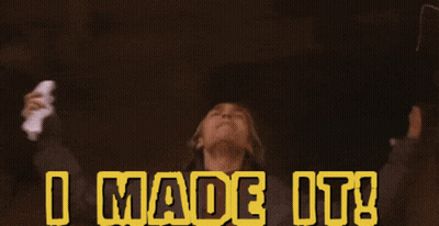 A Person With Their Arms Outstretched And The Words I Made It Behind Them GIF