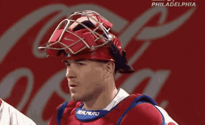 A Philadelphia Baseball Player Wearing A Helmet With A Coca Cola Logo Behind Him GIF