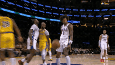 A Philadelphia Basketball Player Dribbles A Ball During A Game GIF