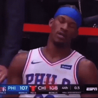 A Philadelphia Basketball Player Is Sitting In The Stands GIF