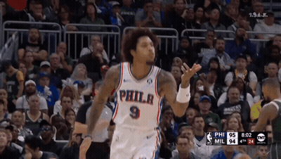 A Philadelphia Basketball Player Stands In Front Of The Crowd GIF