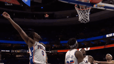A Philadelphia Basketball Player Throws The Ball In The Net GIF