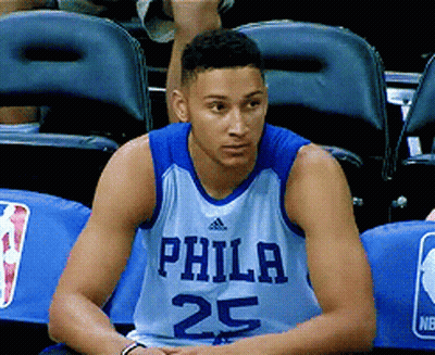 A Philadelphia Basketball Player Wearing Number 25 Sits In The Stands GIF