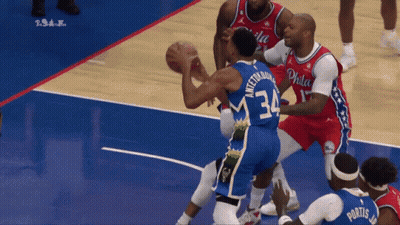 A Philadelphia Basketball Player Wearing Number 34 Tries To Block Another Player GIF