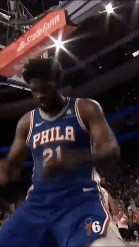 A Philadelphia Basketball Player With The Number 21 On His Shirt GIF