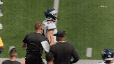A Philadelphia Eagles Football Player Stands On The Field GIF
