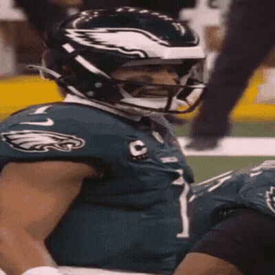 A Philadelphia Eagles Football Player Wearing A Helmet GIF
