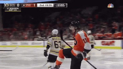A Philadelphia Flyers Hockey Player Kneeling On The Ice During A Game GIF