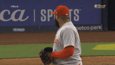 A Philadelphia Phillies Baseball Player Stands On The Field During A Game GIF