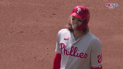 A Phillies Baseball Player Wearing A Red Helmet And Jersey GIF