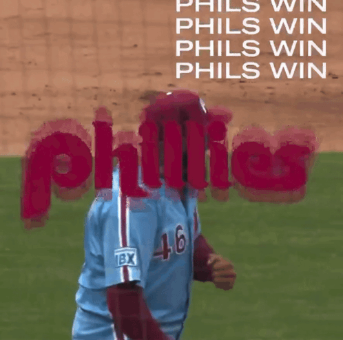 A Phillies Player Wearing A Blue Jersey With The Number 46 On It GIF