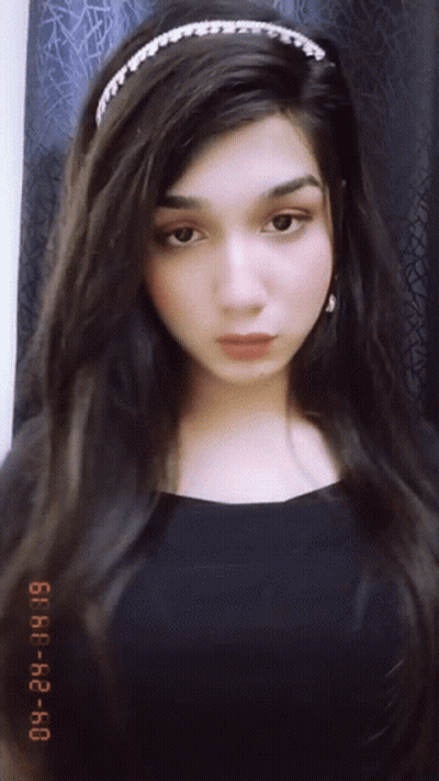 A Photo Of A Woman Taken On January 29Th At 6:40 Pm GIF