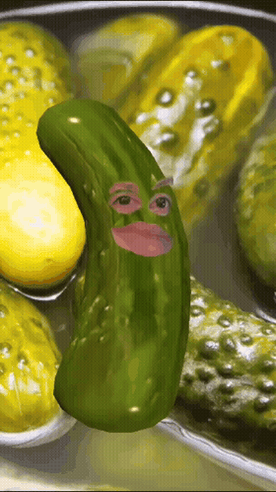 A Pickle With A Face On It Is Surrounded By Other Pickles GIF