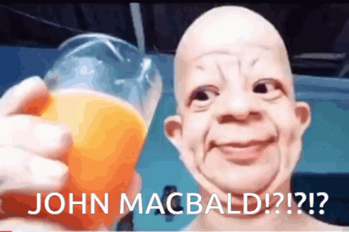 A Picture Of A Bald Man Holding A Glass Of Orange Juice With The Caption " John Macbald " GIF