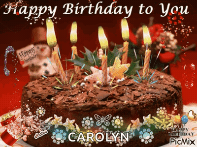 A Picture Of A Birthday Cake With Candles And The Name Carolyn GIF