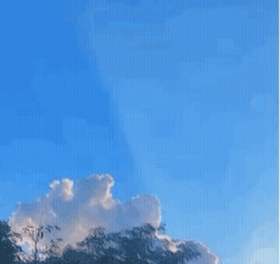 A Picture Of A Blue Sky With A Tree In The Foreground And A Quote In The Middle . GIF