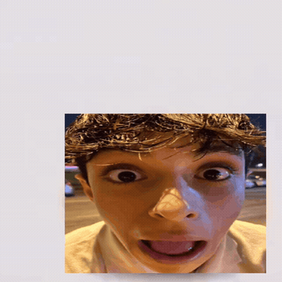 A Picture Of A Boy With His Tongue Out And The Word Holy Above Him GIF