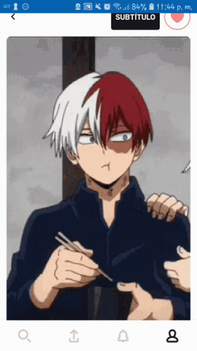 A Picture Of A Boy With Red And White Hair Is Displayed On A Cell Phone Screen GIF