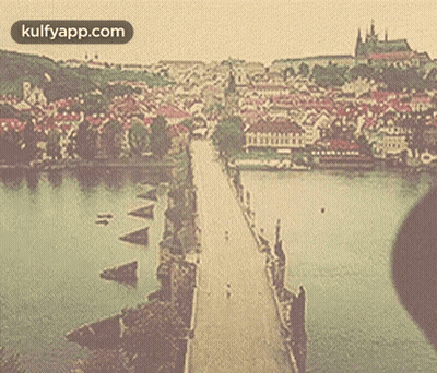 A Picture Of A Bridge Over A Body Of Water With The Website Kulfyapp.com At The Top GIF