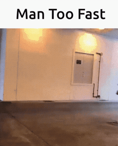 A Picture Of A Building With The Words Man Too Fast GIF