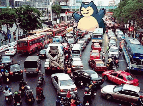 A Picture Of A Busy City Street With A Pokemon On Top Of It GIF