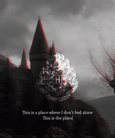 A Picture Of A Castle With A Crest That Says Hogwarts On It GIF