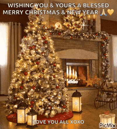 A Picture Of A Christmas Tree In Front Of A Fireplace Wishing You And Yours A Blessed Merry Christmas GIF