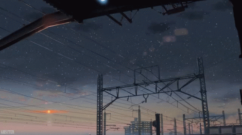 A Picture Of A City At Night With A Starry Sky And A Watermark That Says Mikuton GIF