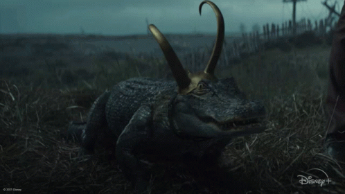 A Picture Of A Crocodile With A Disney Logo In The Background GIF