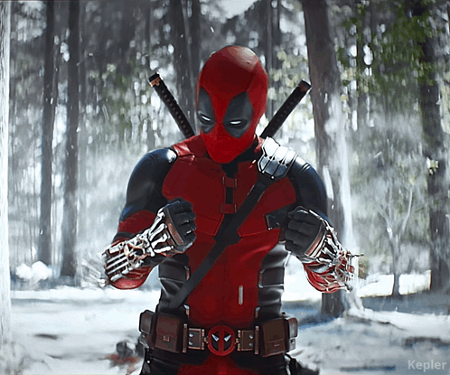 A Picture Of A Deadpool Standing In The Snow GIF