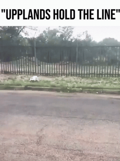 A Picture Of A Fence With The Words " Upplands Hold The Line " On It GIF