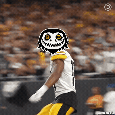 A Picture Of A Football Player With A Mask On His Face With The Letter B On It GIF