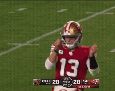 A Picture Of A Football Player With The Words Tough Down Behind Him GIF