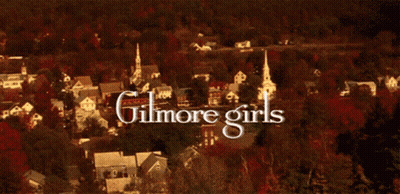 A Picture Of A Forest With The Words Gilmore Girls Written In White GIF