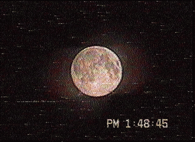 A Picture Of A Full Moon With The Time 1:48 45 GIF