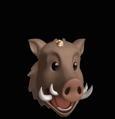 A Picture Of A Girl Behind A Boar 'S Head With Horns GIF