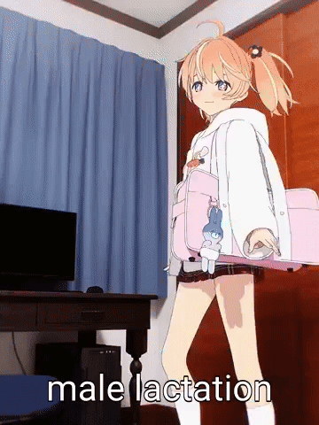 A Picture Of A Girl Holding A Pink Bag That Says Male Lactation On The Bottom GIF